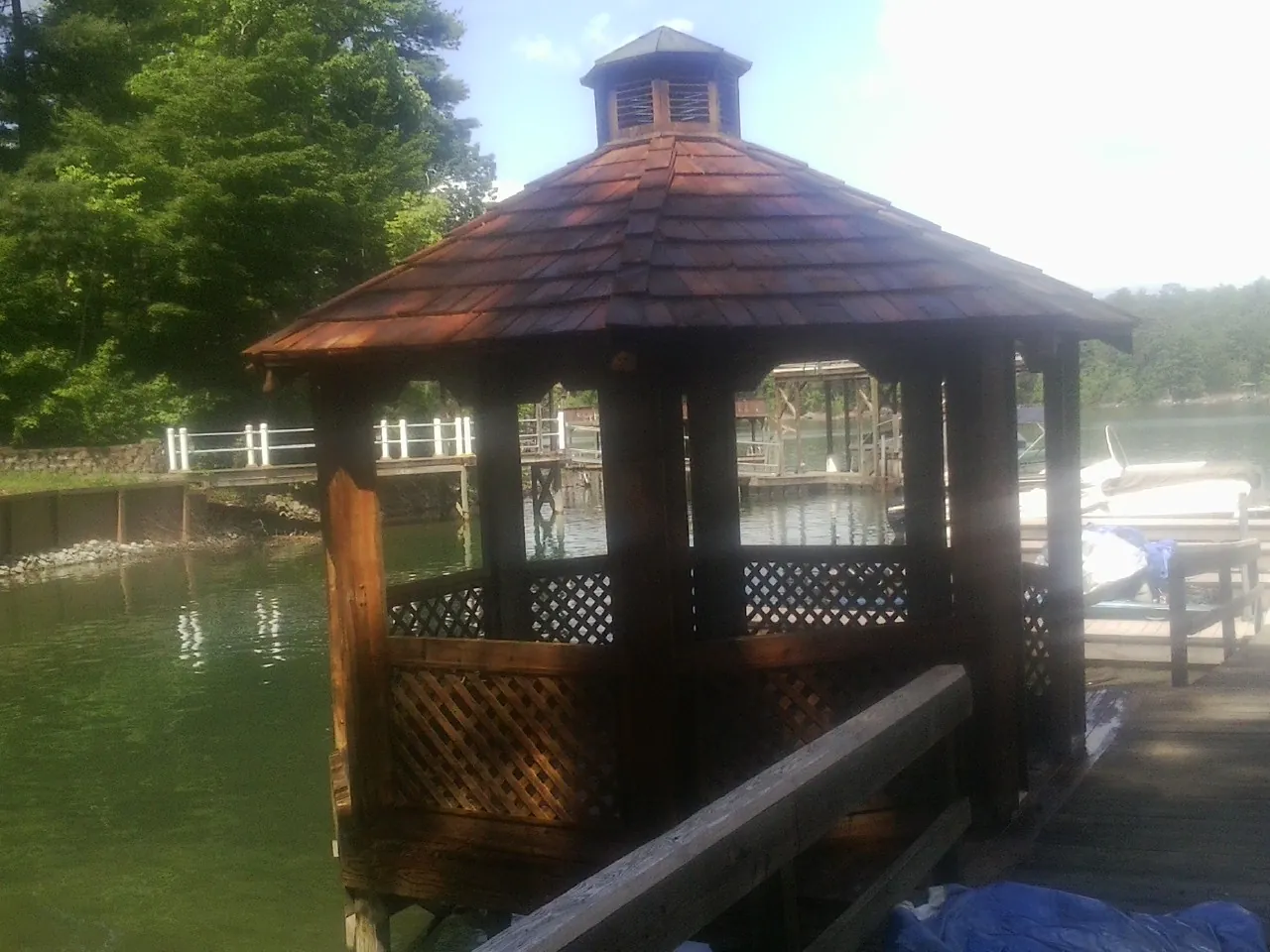 Cedar shake gazebo roof rebuilt on a lake dock in Ivins